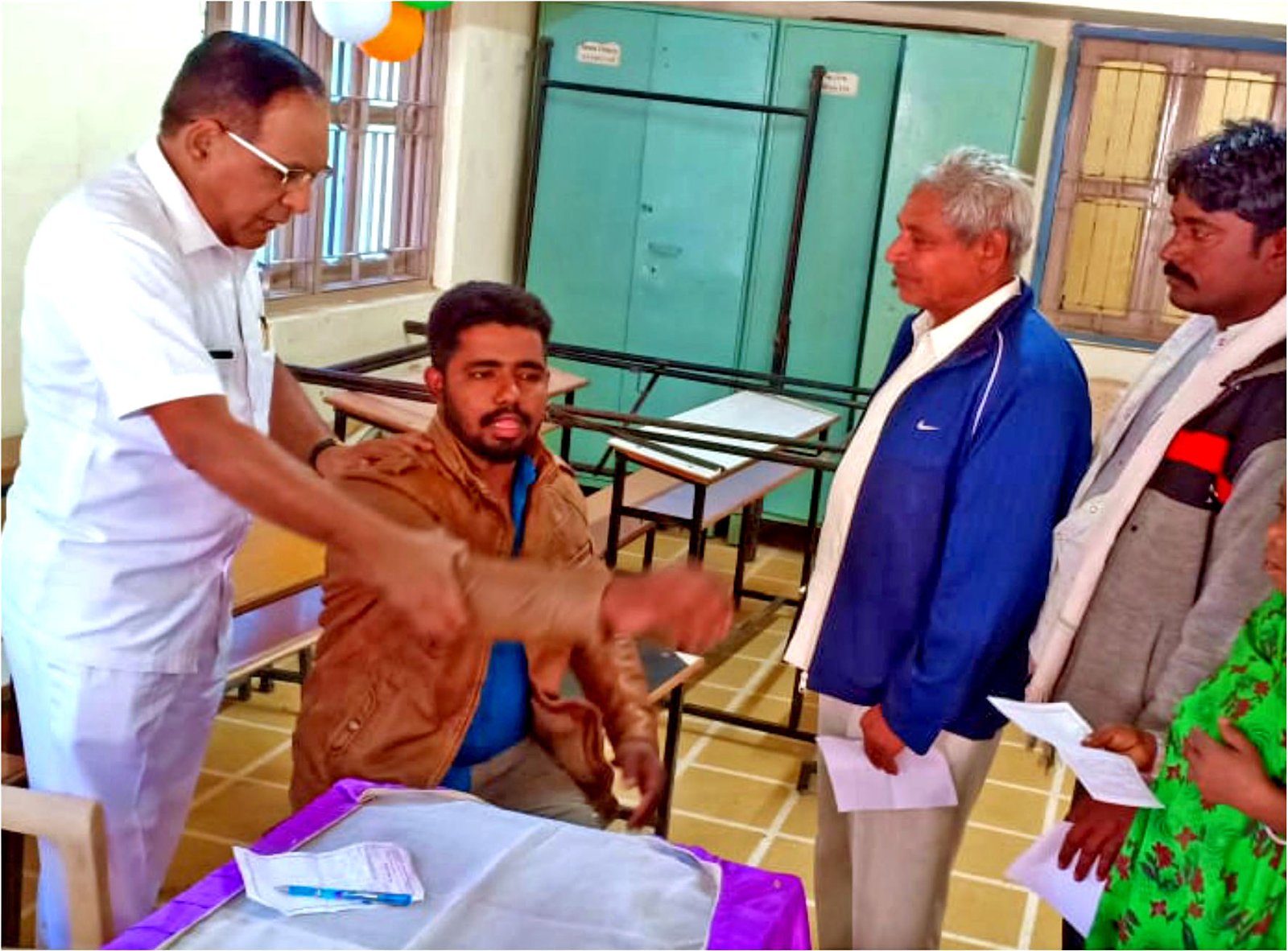 Physicians diagnosing and examining local villagers at Virampur.